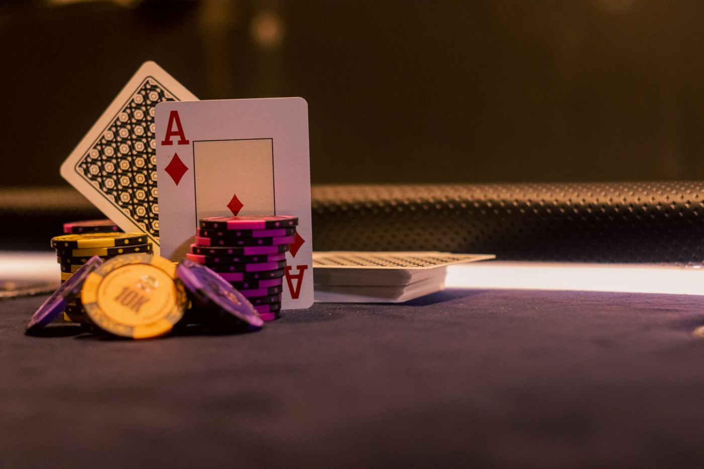 Poker chips and playing cards on a gaming table